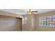 Neutral bedroom with a closet and large window with blinds, providing natural light at 9436 Darwell Dr, Las Vegas, NV 89117