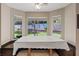 Cozy breakfast nook with built-in seating, a table with a white tablecloth, and backyard views at 9436 Darwell Dr, Las Vegas, NV 89117