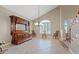 Elegant dining room with classic furniture, decorative lighting, and a large window with plantation shutters at 9436 Darwell Dr, Las Vegas, NV 89117