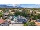A bright blue home with solar panels, RV parking, and a backyard swimming pool in a residential area at 9436 Darwell Dr, Las Vegas, NV 89117