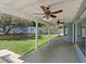 Spacious covered patio with ceiling fans overlooking the landscaped backyard at 9436 Darwell Dr, Las Vegas, NV 89117