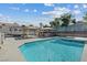 Inviting pool with spa, outdoor kitchen and covered parking in the well-kept backyard at 9436 Darwell Dr, Las Vegas, NV 89117