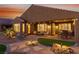 Landscaped backyard with covered patio, outdoor kitchen, and beautiful desert landscaping at 977 Majestic Vw, Mesquite, NV 89034