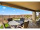 Spacious backyard with covered patio, outdoor seating, and gorgeous mountain views at 977 Majestic Vw, Mesquite, NV 89034