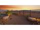 Backyard with desert landscaping, mountain views, and a wrought iron fence at 977 Majestic Vw, Mesquite, NV 89034