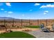 Backyard patio features desert landscaping and wrought iron fence with mountain views at 977 Majestic Vw, Mesquite, NV 89034