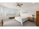 Bright bedroom featuring white walls, large windows, and a cozy bed at 977 Majestic Vw, Mesquite, NV 89034