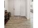 Inviting entryway features wood-look tile flooring and a patterned rug leading to a white front door at 977 Majestic Vw, Mesquite, NV 89034