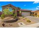 Inviting single-story home featuring desert landscaping and a spacious three-car garage at 977 Majestic Vw, Mesquite, NV 89034