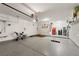 Spacious garage with epoxy floor, overhead storage, and room for storage and activities at 977 Majestic Vw, Mesquite, NV 89034