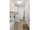 Functional laundry room featuring a washer, dryer, cabinets, and tile flooring at 977 Majestic Vw, Mesquite, NV 89034