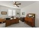 Bright home office features a ceiling fan and traditional wood furniture at 977 Majestic Vw, Mesquite, NV 89034