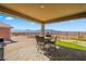 Covered patio with stunning mountain views with a dining set for relaxing outdoors at 977 Majestic Vw, Mesquite, NV 89034