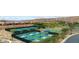 Community recreation area featuring tennis and bocce ball courts surrounded by landscaping and mountain views at 977 Majestic Vw, Mesquite, NV 89034