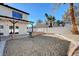 The cozy backyard features a covered patio area, rock landscape, and a brick border at , Henderson, NV 89014