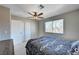 Neutral bedroom featuring a ceiling fan, window with blinds, and a double door closet at , Henderson, NV 89014