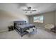 Bedroom featuring a ceiling fan, a patterned bedspread, neutral walls, carpet and a window at , Henderson, NV 89014