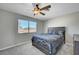 Cozy bedroom showcasing ample natural light, a bed, and a gray nightstand that enhances the space at , Henderson, NV 89014