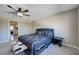 Bedroom featuring a patterned bedspread, neutral walls, carpet and a ceiling fan at , Henderson, NV 89014