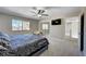 Comfortable bedroom featuring a ceiling fan, natural light, and an open doorway to the rest of the house at , Henderson, NV 89014