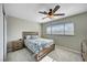 Cozy bedroom featuring soft carpet, ceiling fan, window with blinds, and tasteful decor at , Henderson, NV 89014