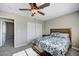 Tastefully decorated bedroom featuring a ceiling fan, bedside table, and double door closet at , Henderson, NV 89014