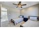 Well-lit bedroom featuring two twin beds, a ceiling fan, and an open doorway that looks out to the landing at , Henderson, NV 89014