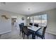 Charming dining room featuring modern light fixture and large window providing natural light at , Henderson, NV 89014