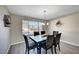Elegant dining room with modern accents, pendant lighting, and window with a view at , Henderson, NV 89014