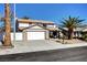 Charming two-story home featuring a well-manicured yard and two car garage on a sunny day at , Henderson, NV 89014