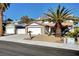 Inviting two-story home with mature landscaping, a two-car garage, and a separate garage at , Henderson, NV 89014