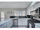 Bright kitchen featuring white cabinets, stainless steel appliances, marble countertops and a garden window at , Henderson, NV 89014