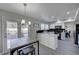 Modern kitchen featuring white cabinetry, stainless steel appliances, and an adjacent dining area at , Henderson, NV 89014