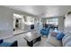 Open living area with views of the foyer, stairs, and dining room for a seamless design at , Henderson, NV 89014