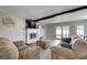 Cozy living room featuring a fireplace, comfortable seating, and easy access to the outdoors at , Henderson, NV 89014