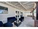 Inviting covered patio with modern furniture, string lights, and access to the pool area at , Henderson, NV 89014