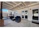 Charming covered patio with stylish outdoor furniture, string lights, and easy access to the pool at , Henderson, NV 89014