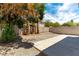 A cozy backyard features a gravel area, a paved patio, and mature shade trees at 10162 Lemon Thyme St, Las Vegas, NV 89183