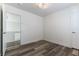 Bedroom featuring wood-look floors and a door leading to another room at 10162 Lemon Thyme St, Las Vegas, NV 89183