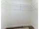 Walk-in closet with white wire shelving and wood-look floors at 10162 Lemon Thyme St, Las Vegas, NV 89183
