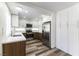 Kitchen featuring two-tone cabinets, stainless steel appliances and wood laminate flooring at 10162 Lemon Thyme St, Las Vegas, NV 89183