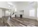Living room with high ceilings, laminate flooring, and fireplace at 10162 Lemon Thyme St, Las Vegas, NV 89183