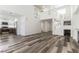 Living room featuring laminate flooring, high ceilings and view to kitchen and foyer at 10162 Lemon Thyme St, Las Vegas, NV 89183
