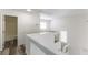 Upstairs loft area features white railings and view to the bathroom at 10162 Lemon Thyme St, Las Vegas, NV 89183
