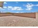 The backyard is low-maintenance and includes gravel, block fence and a brick patio, creating an inviting space at 10345 Zebra Swallowtail St, Las Vegas, NV 89141