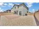 Private backyard features a brick patio and desert landscaping, ideal for outdoor entertaining and relaxation at 10345 Zebra Swallowtail St, Las Vegas, NV 89141