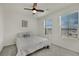 Cozy bedroom with soft lighting, comfortable bed, and window at 10345 Zebra Swallowtail St, Las Vegas, NV 89141