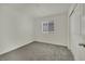 Bedroom showcasing neutral walls, carpet flooring, window with blinds, and closet creating a serene retreat at 10345 Zebra Swallowtail St, Las Vegas, NV 89141