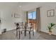 Charming dining area with sliding glass doors leading to the backyard at 10345 Zebra Swallowtail St, Las Vegas, NV 89141
