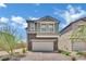 Charming two-story home with stone accents and a brick driveway at 10345 Zebra Swallowtail St, Las Vegas, NV 89141